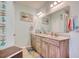 Coastal bathroom featuring double sinks, a large mirror, and beach-themed decor and fixtures at 161 Copper Leaf Dr., Myrtle Beach, SC 29588