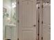 Small powder room featuring a vanity with storage, beachy decor, and a round mirror at 161 Copper Leaf Dr., Myrtle Beach, SC 29588