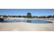 Community pool with ladders into the water and surrounded by a concrete deck and a fence at 161 Copper Leaf Dr., Myrtle Beach, SC 29588