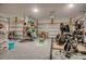 Well-organized garage featuring storage solutions, workout equipment, and ample space for vehicles and projects at 161 Copper Leaf Dr., Myrtle Beach, SC 29588