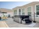 Backyard with a modern hot tub and surrounding patio, perfect for relaxation and outdoor living at 161 Copper Leaf Dr., Myrtle Beach, SC 29588