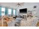 Comfortable living room with a fireplace, large TV, neutral walls, and a ceiling fan at 161 Copper Leaf Dr., Myrtle Beach, SC 29588