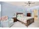 Comfortable main bedroom with a ceiling fan, matching nightstands, and coastal decor at 161 Copper Leaf Dr., Myrtle Beach, SC 29588