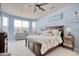Calming main bedroom with a ceiling fan and large windows offering plenty of natural light at 161 Copper Leaf Dr., Myrtle Beach, SC 29588