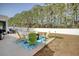 The spacious patio has a variety of outdoor seating options and a fire pit, ideal for gatherings at 161 Copper Leaf Dr., Myrtle Beach, SC 29588