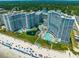 Stunning aerial view of beachfront resort with multiple pools and ocean access at 161 Seawatch Dr. # 808, Myrtle Beach, SC 29572
