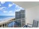 Balcony with a view of the ocean, sandy beach, swimming pool, and neighboring condos at 161 Seawatch Dr. # 808, Myrtle Beach, SC 29572