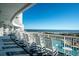Inviting balcony featuring rocking chairs overlooking the ocean, offering a perfect spot to relax and enjoy the view at 161 Seawatch Dr. # 808, Myrtle Beach, SC 29572