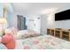 Comfortable bedroom featuring two beds with a TV and view of the outside at 161 Seawatch Dr. # 808, Myrtle Beach, SC 29572