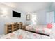 Bright bedroom featuring two beds with seashell-themed bedding, TV, and wood furnishings at 161 Seawatch Dr. # 808, Myrtle Beach, SC 29572
