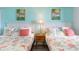 Charming bedroom with twin beds, decorative pillows, lamps, and beach-themed wall art at 161 Seawatch Dr. # 808, Myrtle Beach, SC 29572
