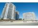 Stunning beachfront condo complex with multiple balconies overlooking a pristine sandy beach at 161 Seawatch Dr. # 808, Myrtle Beach, SC 29572