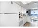 Functional kitchen featuring modern appliances, white cabinets and breakfast bar with seating at 161 Seawatch Dr. # 808, Myrtle Beach, SC 29572