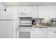Clean, well-lit kitchen with white appliances and ample counter space at 161 Seawatch Dr. # 808, Myrtle Beach, SC 29572