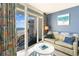 Cozy living room with balcony access and a partial ocean view at 161 Seawatch Dr. # 808, Myrtle Beach, SC 29572