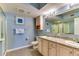 This bathroom has a granite-topped vanity with double sinks, a framed mirror, and a glass-enclosed shower at 1625 S Ocean Blvd. # 802, North Myrtle Beach, SC 29582