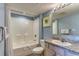 This charming bathroom features a tub with shower, a large mirror, and granite vanity with ample counter space at 1625 S Ocean Blvd. # 802, North Myrtle Beach, SC 29582