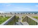 Picturesque beach access with stairs leading to the sandy shore and ocean views at 1625 S Ocean Blvd. # 802, North Myrtle Beach, SC 29582