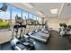 Bright gym with state-of-the-art equipment and large windows offering neighborhood views at 1625 S Ocean Blvd. # 802, North Myrtle Beach, SC 29582