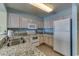 Eat-in kitchen with tile floors and granite countertops at 1625 S Ocean Blvd. # 802, North Myrtle Beach, SC 29582