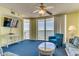 Cozy living room with an ocean view from the large windows and access to a balcony at 1625 S Ocean Blvd. # 802, North Myrtle Beach, SC 29582