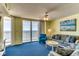 Inviting living room with an ocean view, comfortable seating, and a beach-themed painting at 1625 S Ocean Blvd. # 802, North Myrtle Beach, SC 29582