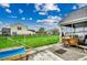 Inviting backyard features a screened-in porch and a sprawling green lawn, perfect for relaxation at 177 Tibton Circle, Myrtle Beach, SC 29588