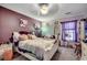 Cozy bedroom features a ceiling fan, ample space, and natural light, creating a warm and inviting atmosphere at 177 Tibton Circle, Myrtle Beach, SC 29588