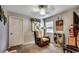 Comfortable bedroom with cozy chair, neutral carpet, and a sunny window, creating a relaxing retreat at 177 Tibton Circle, Myrtle Beach, SC 29588