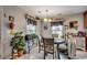 Charming dining area with natural light, plants, and decorative accents at 177 Tibton Circle, Myrtle Beach, SC 29588