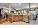 Well-lit kitchen featuring modern appliances, breakfast bar, and access to the living spaces at 177 Tibton Circle, Myrtle Beach, SC 29588