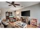 Relaxing living room with ceiling fan, hardwood floors, and cozy furnishings at 177 Tibton Circle, Myrtle Beach, SC 29588