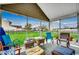 Relaxing screened-in porch featuring comfortable seating and an open view of the lush backyard at 177 Tibton Circle, Myrtle Beach, SC 29588