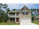 Charming two-story home featuring a welcoming front porch and a convenient two-car garage at 1848 Hardwood Ct., Conway, SC 29526