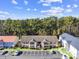Aerial view of the multi-Gathering buildings, green spaces, parking, and trees at 197 Charter Dr. # D-8, Longs, SC 29568