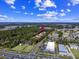 An aerial view shows a community near lush woods and a well-traveled road at 197 Charter Dr. # D-8, Longs, SC 29568