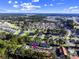 An aerial view of the neighborhood shows lush landscaping, a pond, and orderly parking at 197 Charter Dr. # D-8, Longs, SC 29568