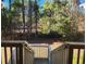 View of the backyard from the deck, featuring trees and stairs at 197 Charter Dr. # D-8, Longs, SC 29568