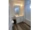 Bathroom features a vanity, mirror, lighting, toilet, and shower/tub combo with curtain at 197 Charter Dr. # D-8, Longs, SC 29568