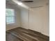 Bright bedroom with wood floors, ceiling fan, window with blinds, and closet at 197 Charter Dr. # D-8, Longs, SC 29568