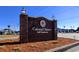 A brick sign for Colonial Charters Golf Community stands on a sunny day with manicured landscaping at 197 Charter Dr. # D-8, Longs, SC 29568