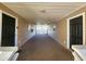 Hallway with beige siding and black doors leading to individual units at 197 Charter Dr. # D-8, Longs, SC 29568