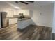 Bright kitchen featuring stainless steel appliances, sleek flooring, and fresh white cabinets at 197 Charter Dr. # D-8, Longs, SC 29568