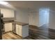 This updated kitchen showcases new flooring, stainless steel appliances, and modern cabinets at 197 Charter Dr. # D-8, Longs, SC 29568