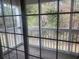 View from screened porch to green foliage at 197 Charter Dr. # D-8, Longs, SC 29568