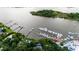 Beautiful coastal estate featuring boat dock, pool, mature trees, and lush lawns with direct access to the serene bay at 201 River Rd., Georgetown, SC 29440