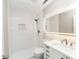 A tiled bathroom with a walk-in shower, contemporary vanity, and LED mirror at 201 River Rd., Georgetown, SC 29440