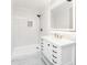 Contemporary bathroom with marble floors, walk-in shower, and illuminated mirror at 201 River Rd., Georgetown, SC 29440