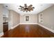 Expansive living area with hardwood floors, kitchenette, ceiling fan, and large windows at 201 River Rd., Georgetown, SC 29440