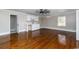 Open living room features wood floors, recessed lighting, and kitchenette space at 201 River Rd., Georgetown, SC 29440